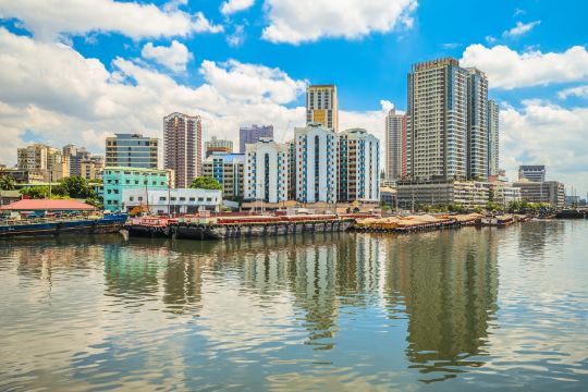 Pasig River with the Metro Manila skyline behind it
