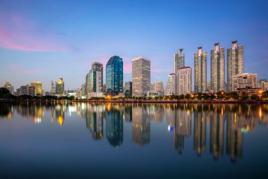 The lake at Benjakitti Park at dusk, with the Sukhumvit skyline reflected in the water