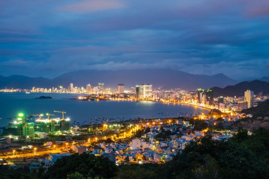 Da Nang seafront towers lit at night, close to Phuoc My hotels