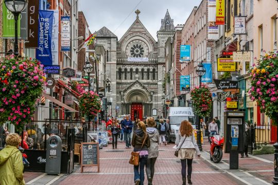 Grafton Street in Dublin, with its hanging flower baskets and shopfronts