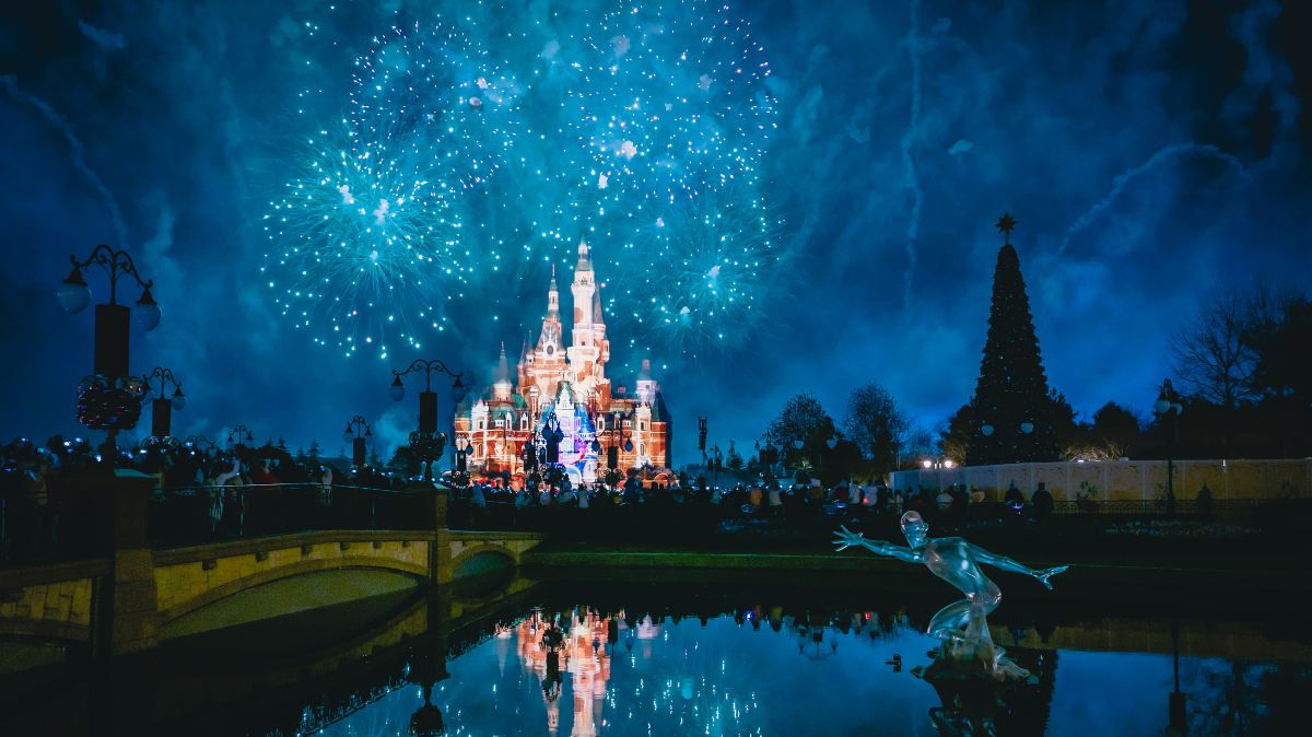 Shanghai Disney Resort castle lit up during the evening fireworks show