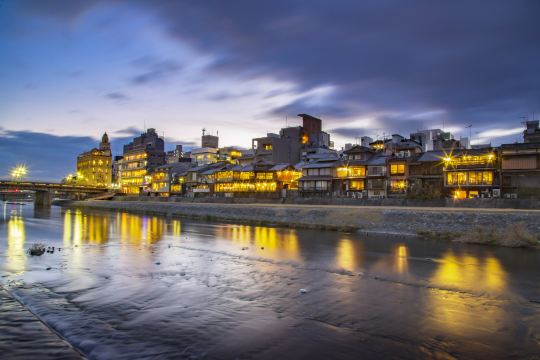 Evening lights along the Kamo River in Kawaramachi, near Kyoto hotels
