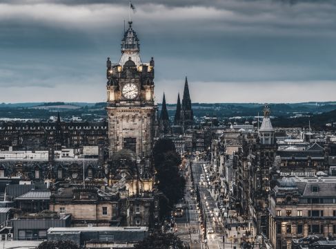 Princes Street and the Balmoral clock tower in Edinburgh's New Town at dusk
