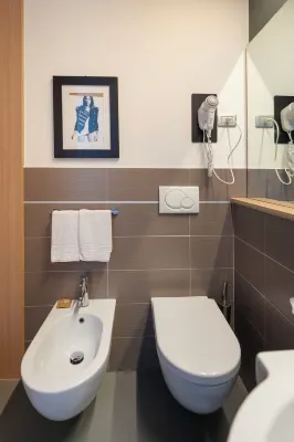 The Aries Hotel Kamar Photos