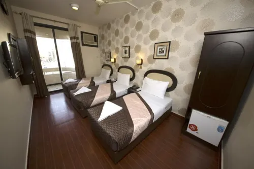 Grand Sina Hotel Rooms Photos