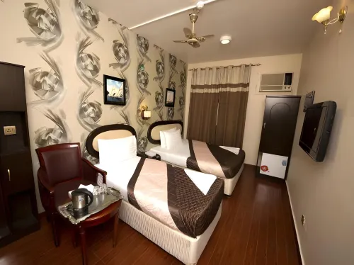 Grand Sina Hotel Rooms Photos