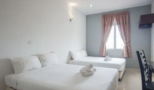 OYO 275 Senyum Inn Chambres Photos