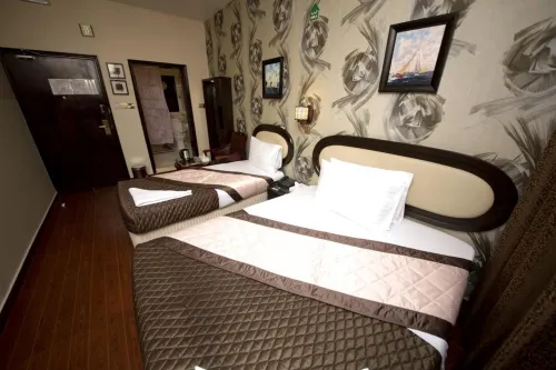 Grand Sina Hotel Rooms Photos
