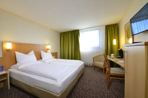 PLAZA INN Leonberg Chambres Photos