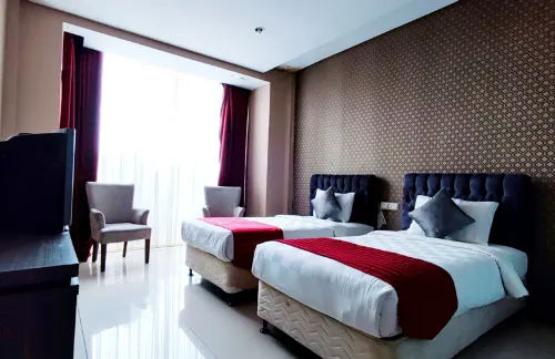 The Rizen Hotel Kamar Photos