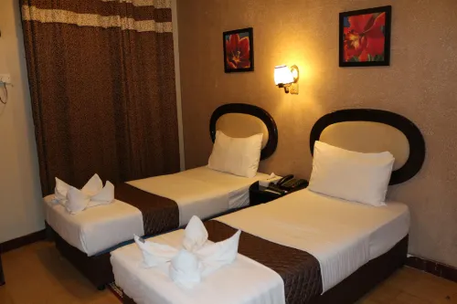 Grand Sina Hotel Rooms Photos