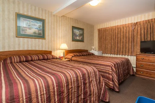 Canadas Best Value Inn Chinook Station Rooms Photos