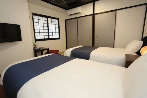 Rozy Hotel Namba Camere Photos
