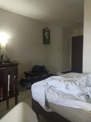 Nirmala Hotel & Convention Centre Kamar Photos