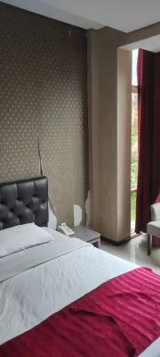 The Rizen Hotel Kamar Photos