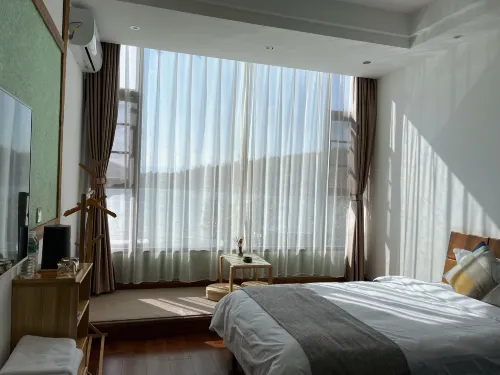 Qingwu Hotel Rooms Photos