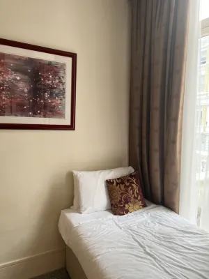 The Park City Grand Plaza Kensington Hotel Camere Photos