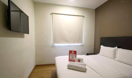 Capital O 91074 Grand World Hotel Zimmer Photos