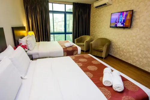 Capital O 91074 Grand World Hotel Zimmer Photos