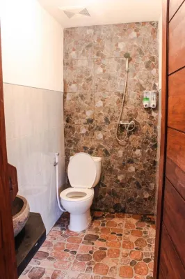 Griya Gribig Guest House Mitra RedDoorz Chambres Photos
