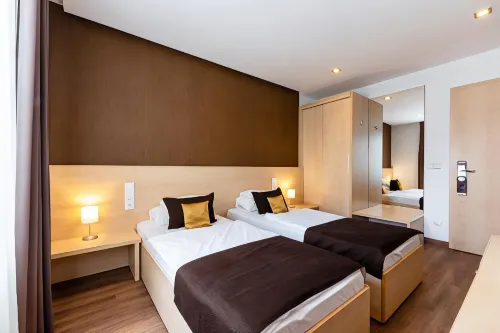 Promenade City Hotel Rooms Photos