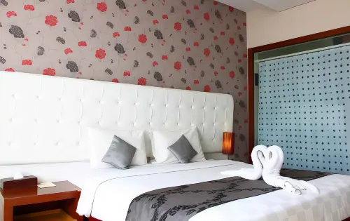 The Rizen Hotel Kamar Photos