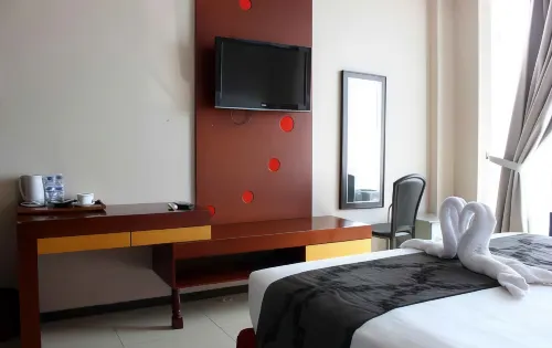 The Rizen Hotel Kamar Photos