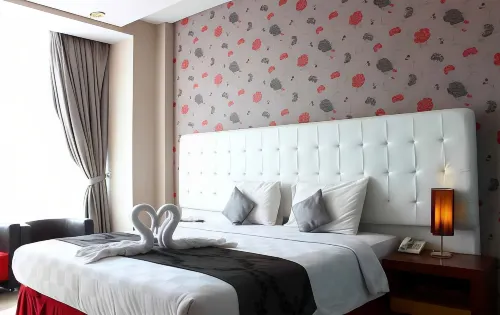 The Rizen Hotel Kamar Photos