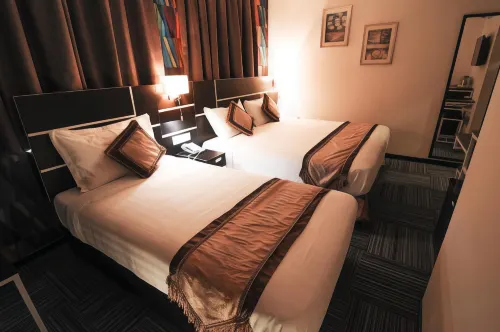 K GARDEN HOTEL PARIT BUNTAR Chambres Photos