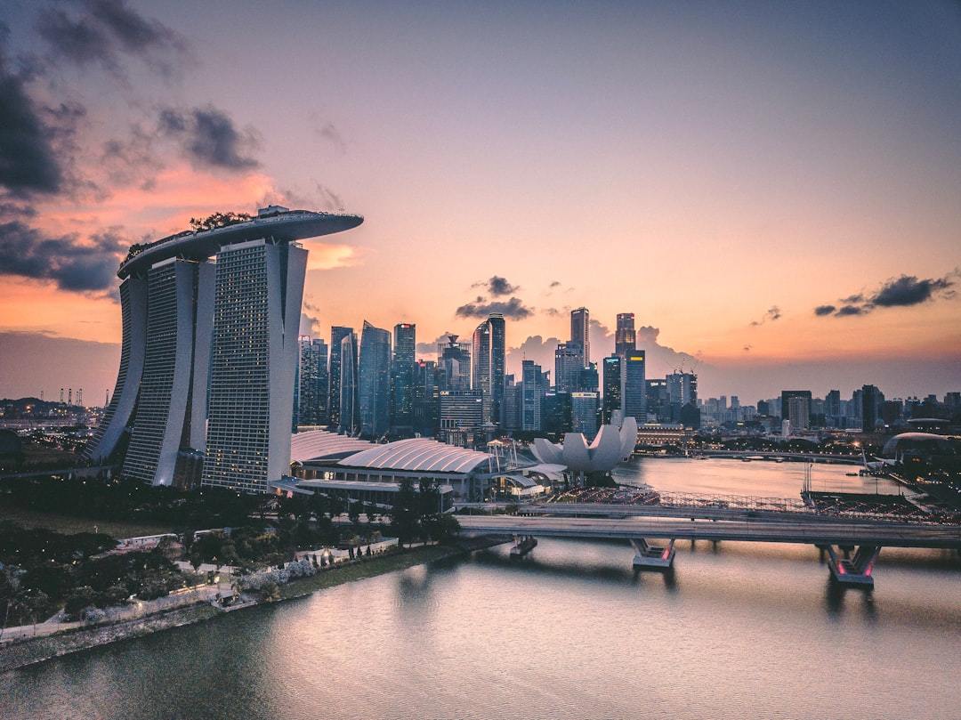 a large body of water with a city in the background Via Unsplash (by Swapnil Bapat)