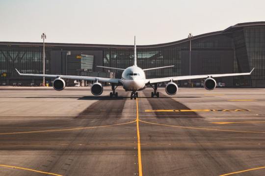 white airplane Via Unsplash (by Bao Menglong)