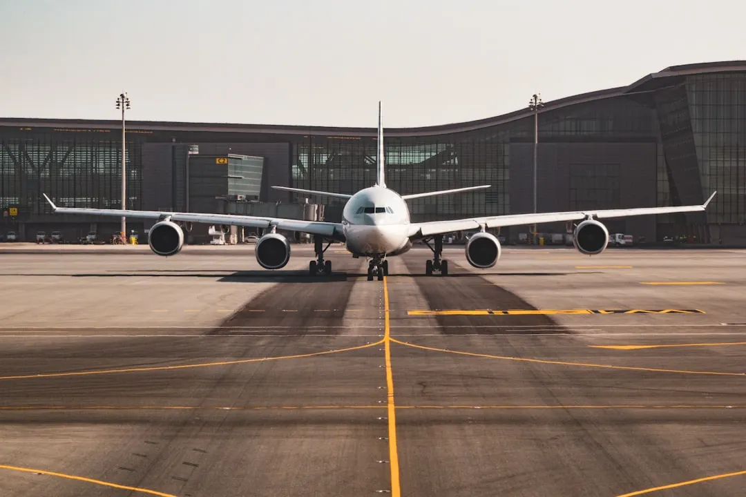 white airplane Via Unsplash (by Bao Menglong)