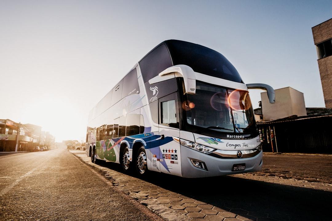 gray and black bus parked during daytime Via Unsplash (by Jonathan Borba)