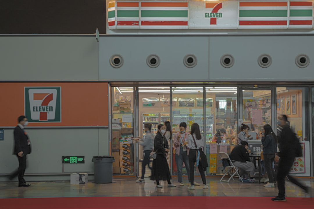 people walking in front of store Via Unsplash (by Decry.Yae)