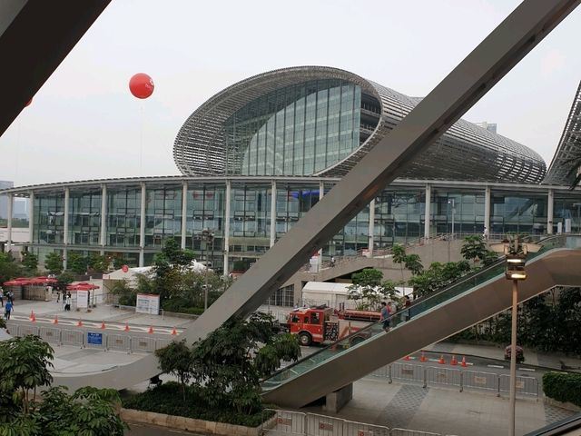 A pavilion at the Canton Fair complex in Guangzhou and the escalator at the entrance