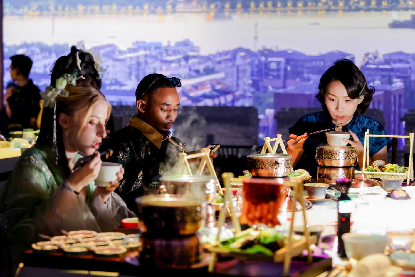 Having Chinese dishes at Taste of China with traditional costumes