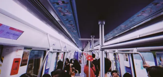 Interior of a Shanghai Metro train with passengers standing
