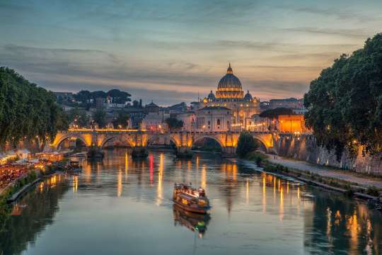 Sunset over the Tiber River in Rome, Italy.