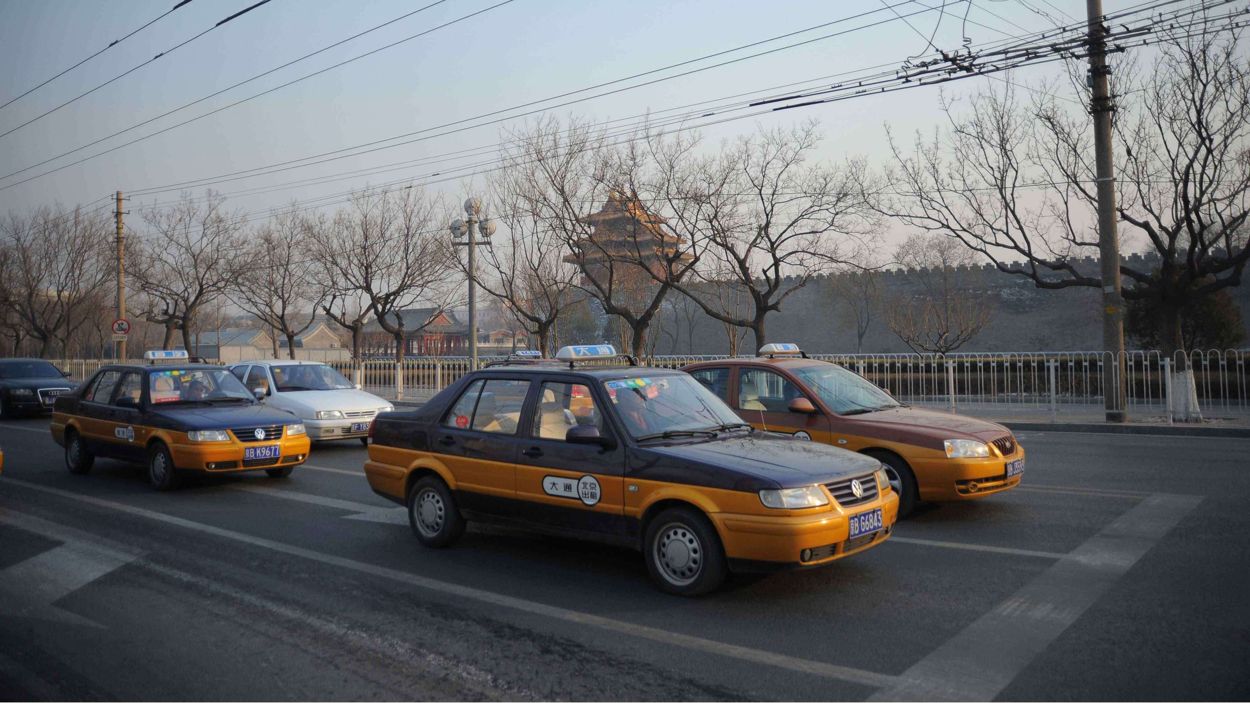 Beijing Taxis are waiting at the lights