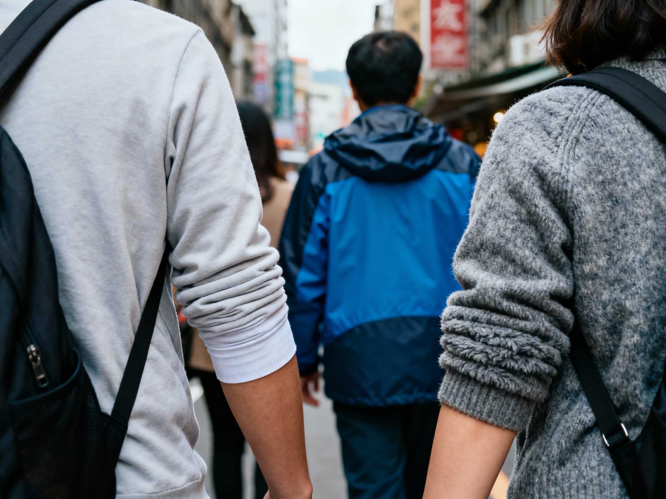 people wearing sweater and fleece