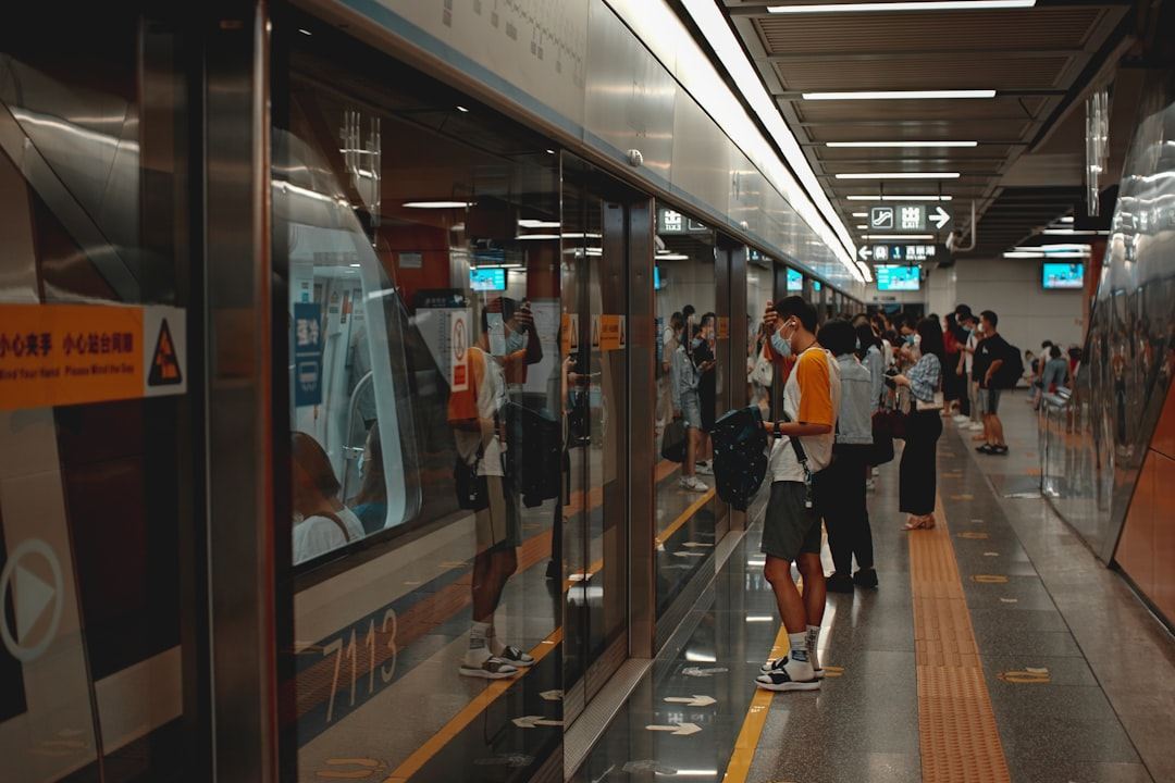 people walking in train station Via Unsplash (by Joshua Fernandez)