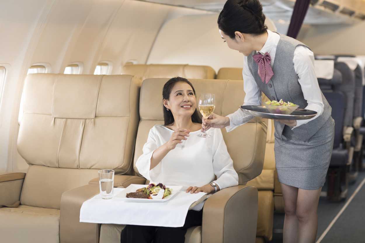 an air stewardess serving a customer