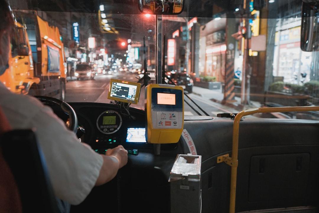 person holding black and yellow digital device Via Unsplash (by Lisanto 李奕良)