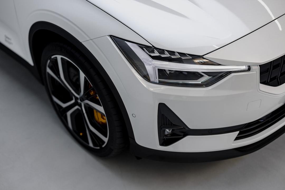 a white car is parked in a garage Via Unsplash (by Patrick Langwallner)