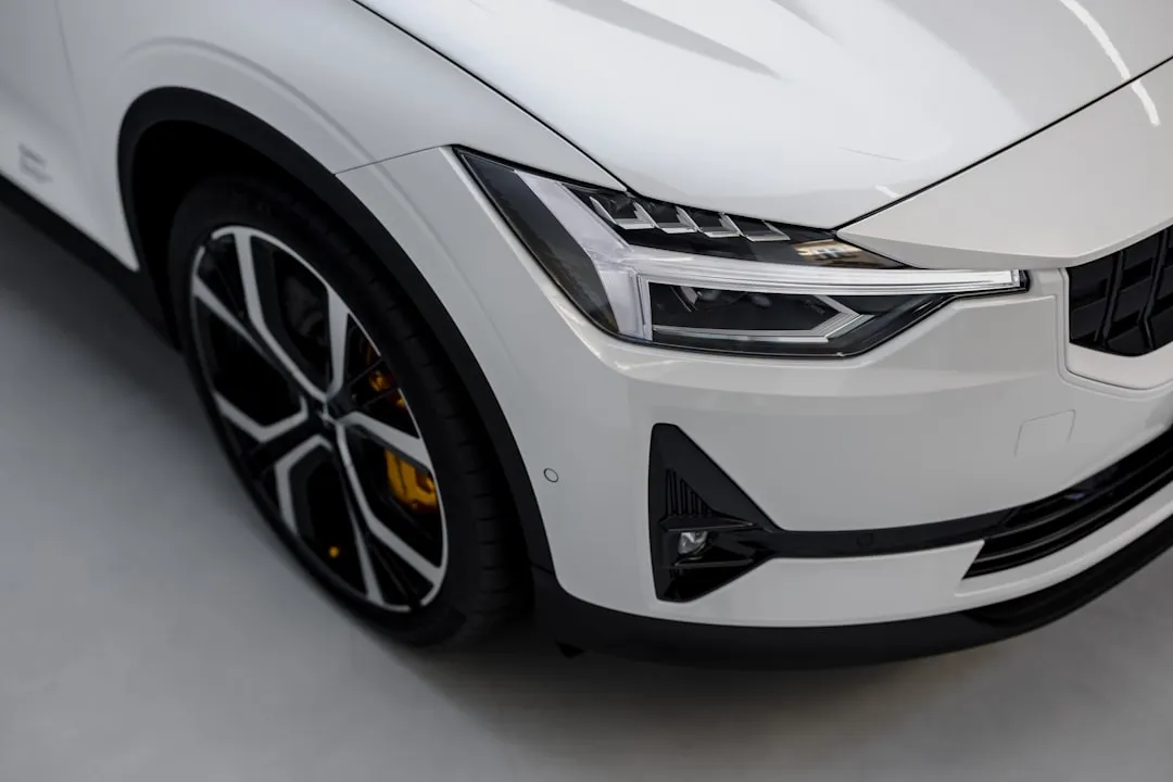 a white car is parked in a garage Via Unsplash (by Patrick Langwallner)