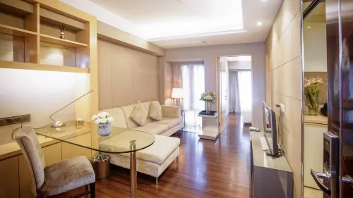 UHOME Executive Apartments Zimmer Photos