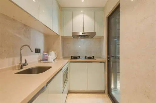 UHOME Executive Apartments Zimmer Photos
