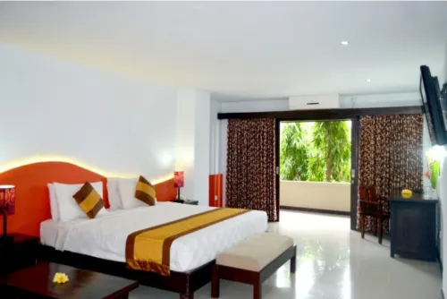 Nirmala Hotel & Convention Centre Kamar Photos