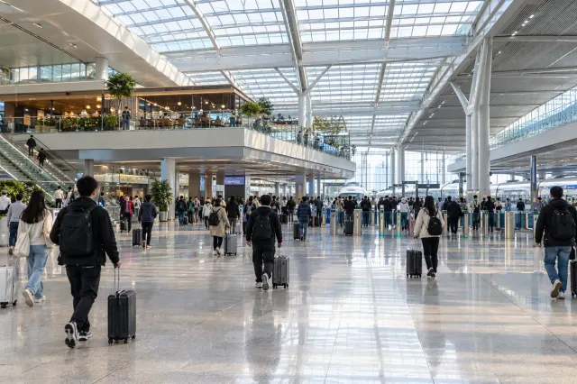 Departure hall of a modern Chengdu railway station with travellers and luggage