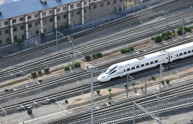 Aerial view of a high-speed train crossing the railway tracks in Shenyang, China